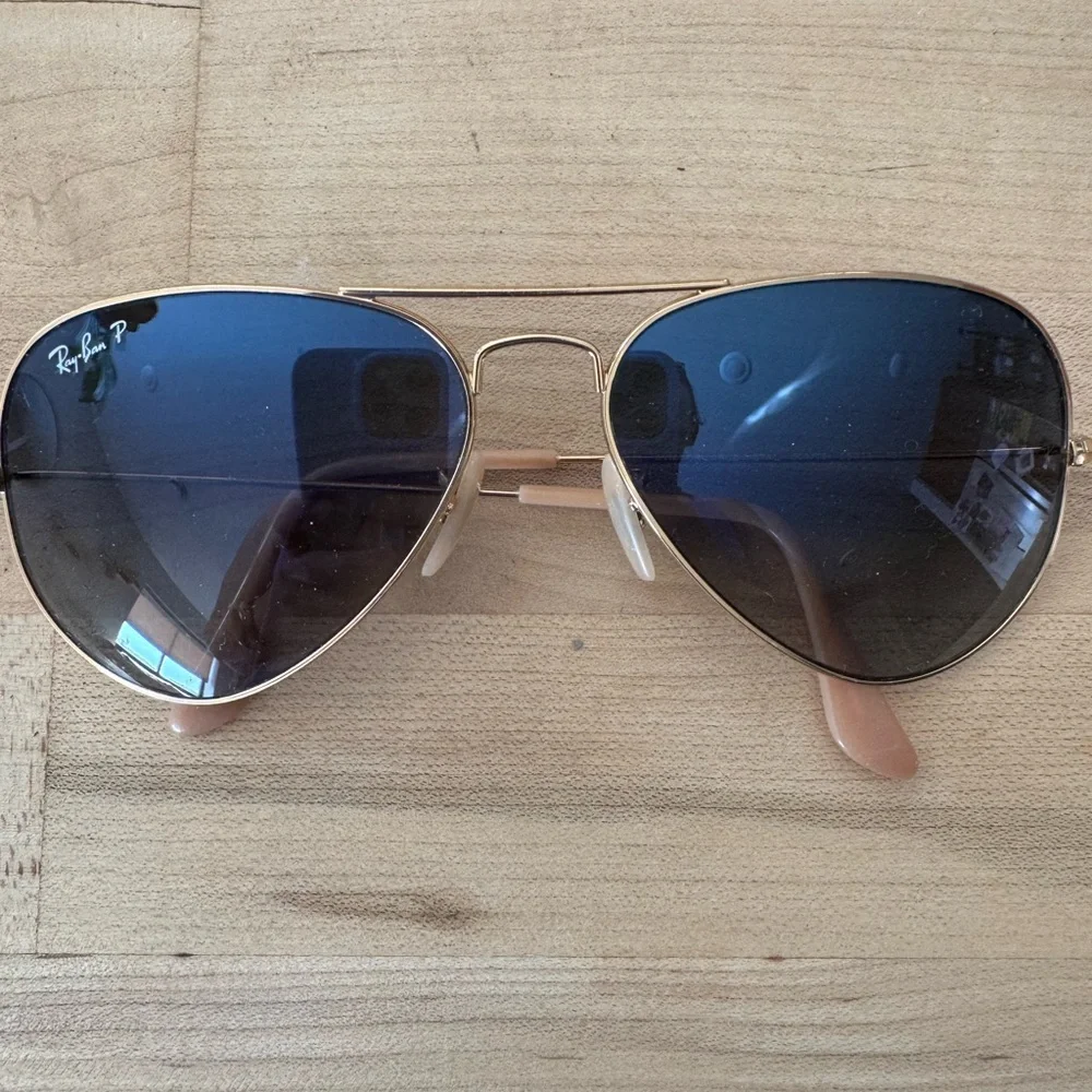 Ray-Ban Gold Frame Sunglasses with polarized Blue Lenses.